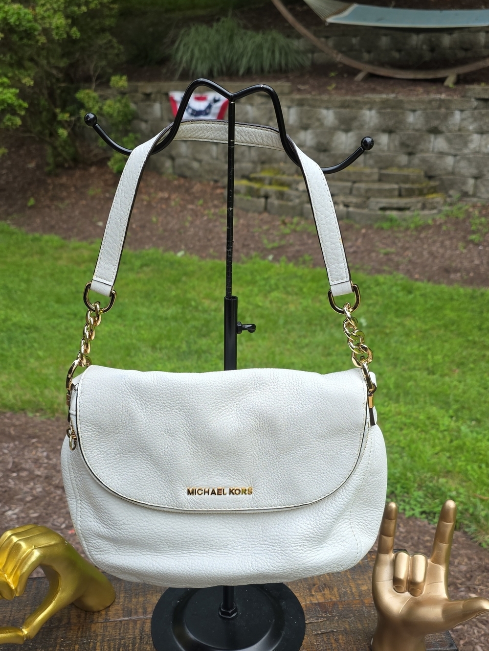 Michael Kors Bedford shoulder bag features a fold-over zipper flap